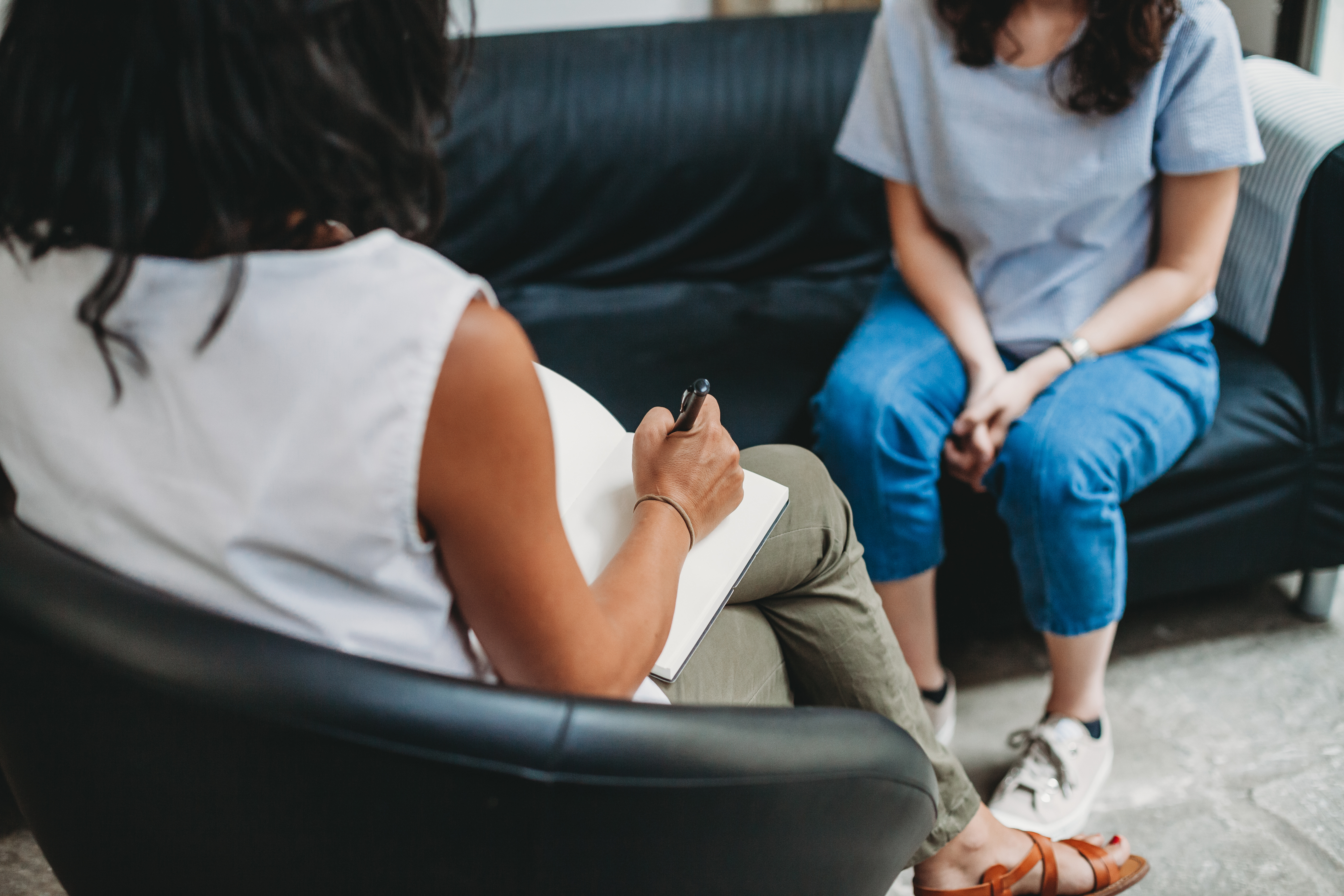 Psychotherapy session, woman talking to his psychologist in the