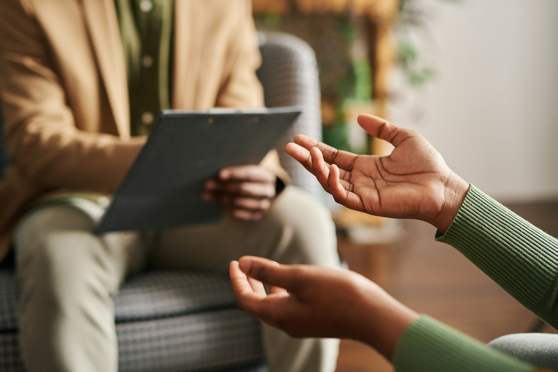 therapist-talking-with-client-taking-notes